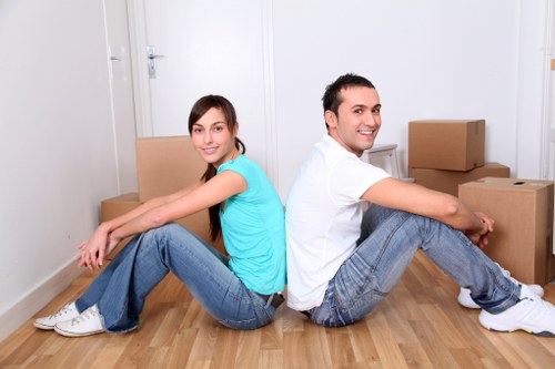 Professional movers handling furniture