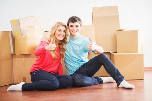 Professional movers packing office items